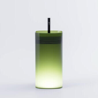 Captivating Norah Design CUCN 02 washbasin crafted in translucent Norahcrystal with a luminous green gradient and seamless silhouette