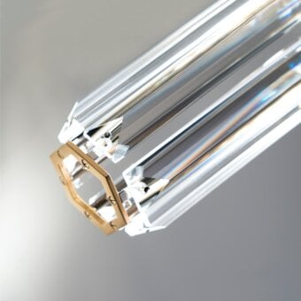 Elegant Patrizia Garganti Chaos Orb chandelier with transparent core encased in polished gold-toned brass hexagonal frame