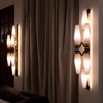 Distinguished Patrizia Garganti Frida wall lamp with vertically oriented shades in dark bronze and warm white hand-blown glass with a satin finish