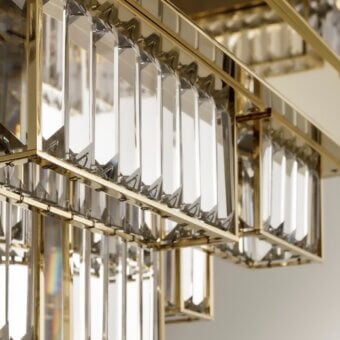 Superior Patrizia Garganti Gisele chandelier with laser-cut steel and clear glass in a glossy golden tone