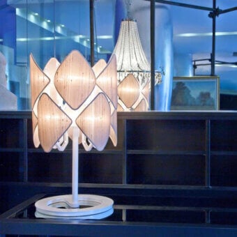 Elegant Patrizia Garganti Holly table lamp with floral-inspired design in pale beige and translucent petals crafted in Italy