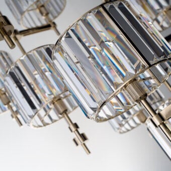 Distinguished Patrizia Garganti Novecento EX04 chandelier with cascading clear cut crystal and polished gold metallic structure