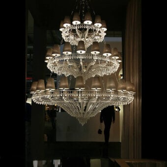 Distinguished Patrizia Garganti Ophelia XL chandelier crafted with clear crystal prisms and polished metal exhibiting beige accents