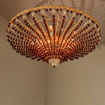 Distinguished Patrizia Garganti Ophelia ceiling lamp with reddish-brown and clear crystal pendants crafted in polished brass