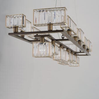 Exceptional Patrizia Garganti Tur chandelier crafted in Italy with transparent crystal lozenges and textured antique brass metallic structure