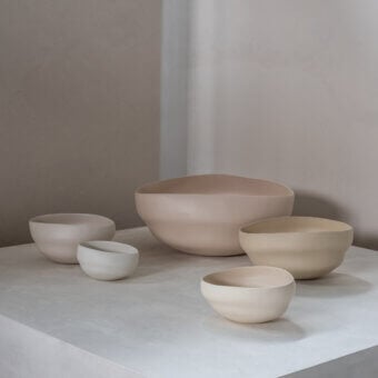 Distinguished Rina Menardi Noci vase crafted in Italy with gently curved forms and a smooth matte finish in neutral beige tones