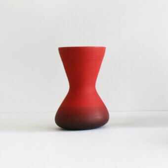 Distinguished Rina Menardi Giare vase crafted in Italy with a vibrant red hue and matte synthetic material construction