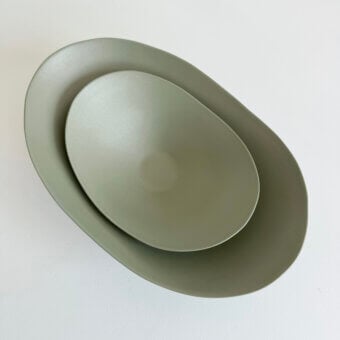Exclusive Rina Menardi Baccelli centerpiece crafted in earthy green baked clay with a smooth matte finish