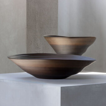 Distinguished Rina Menardi Campanelle plate centerpiece crafted from baked clay with a smooth, textured finish and warm brown tone