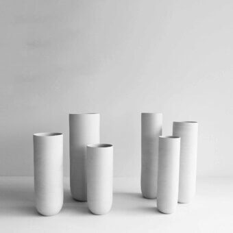 Exceptional Rina Menardi Canne vase crafted from baked clay in a uniform light gray with a smooth matte finish