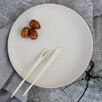 Superior Rina Menardi Cerchi plates crafted in baked clay with a smooth matte finish and tonal variations