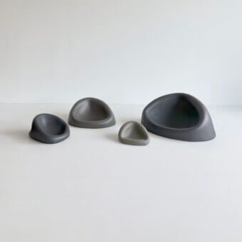 Superior Rina Menardi Clio centerpiece crafted from baked clay in cool gray shades with a matte finish