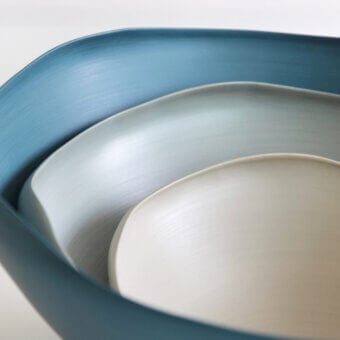 Distinguished Rina Menardi Conchiglie centerpiece crafted in baked clay with a captivating gradient of blue-grey and cream tones