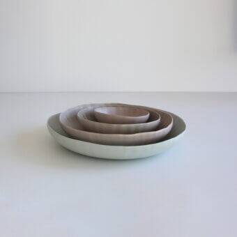Harmonious Rina Menardi Fiori centerpiece crafted in Italy from baked clay with undulating forms and a smooth matte finish