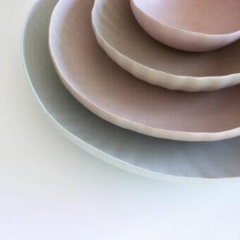 Exclusive Rina Menardi Fiori centerpiece crafted in baked clay with soft blush pink finish and layered sculptural form
