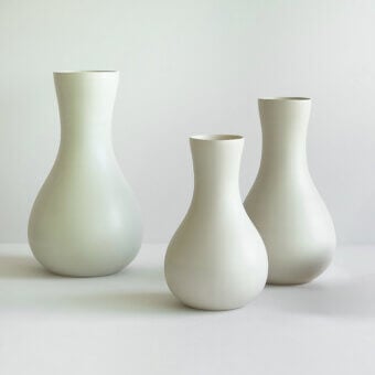 Elegant Rina Menardi Lepos vase crafted in muted pale green ceramic with a smooth matte finish