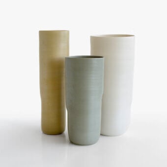 Distinguished Rina Menardi Menhir vase crafted in Italy with golden-yellow ceramic and sophisticated matte finish