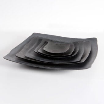 Exceptional Rina Menardi Quadri centerpiece crafted in textured wood with a dark gray finish for layered display