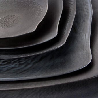 Elegant Rina Menardi Quadri centerpiece crafted in dark-toned wood with a matte, heavily textured finish and subtly irregular edges