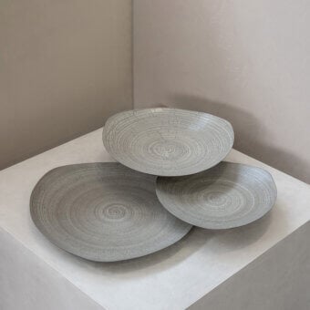 Exceptional Rina Menardi Triangolo centerpiece, a skilled Italian arrangement in matte gray ceramic with incised lines
