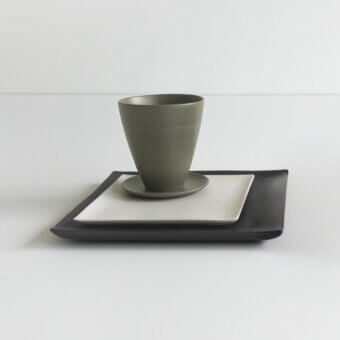 Exclusive Rina Menardi Vassoi Quadrati centerpiece tray with dark gray matte ceramic, olive green cup and bright white saucer