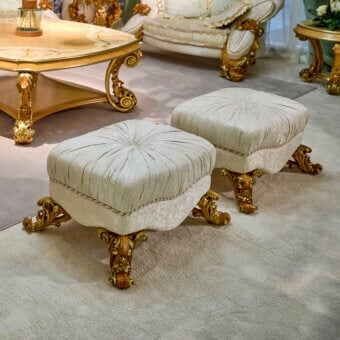 Superior handcrafted ottoman with plush cream and beige upholstery and glossy golden wood finish