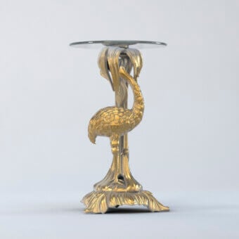 Exceptional Riva Mobili D'Arte 1320 side table crafted in Italy with sculpted bird support and circular glass surface in gleaming gold