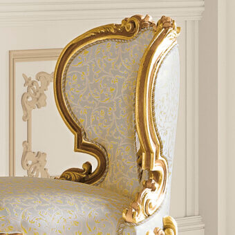 Distinguished Riva Mobili D'Arte 22033 chair crafted in hand-carved wood with glossy golden gilt and pale blue floral textile upholstery