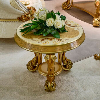 Distinguished Riva Mobili D'Arte 22275 side table crafted in Italy with golden wood and cream detailing exhibiting ornate Rococo curves