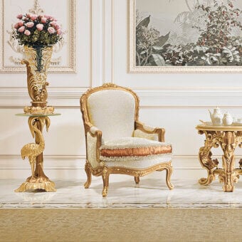 Distinguished Riva Mobili D'Arte 6822 lounge chair with botanical scrolls and a golden tone finish in cream textile with orange accents