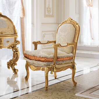 Superior Riva Mobili D'Arte 6823 lounge chair built with terracotta and cream patterned textile upholstery, glossy hand-carved wood with gold details