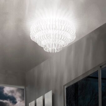 Distinguished Vistosi Ecos ceiling lamp crafted in white hand-blown Murano glass with a signature rigadin texture radiating petal-like elements
