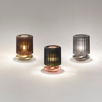 Exceptional Vistosi Tread lamp crafted in dark metal with hand-blown Murano glass exhibiting rhythmic lateral grooves and a polished finish