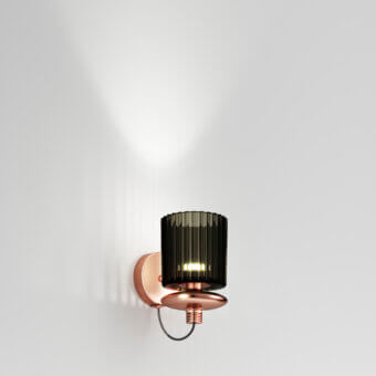 Exceptional Vistosi Tread wall lamp crafted in satin copper-toned metal with a pleated glass diffuser and rhythmic grooves