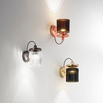 Distinguished Vistosi Tread wall lamp crafted in copper-toned metal with a warm brown pleated glass diffuser and rhythmic lateral grooves