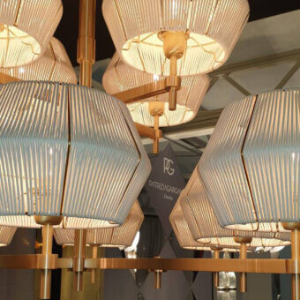 Distinguished Patrizia Garganti Novecento EX03 suspension lamp with pale blue rods and polished gold-toned metal frame crafted in Italy