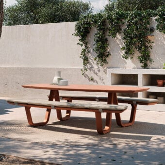 Distinguished Atmosphera 8Teen table with benches crafted in synthetic material with terracotta finish and neutral gray cushions