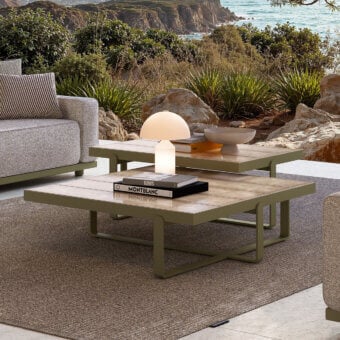 Architectural Atmosphera Capri coffee table with solid aluminum base and glossy glazed lava stone slat top in muted olive green finish