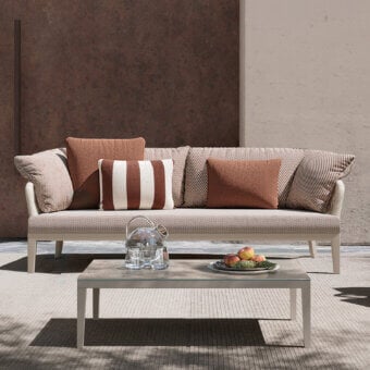Refined Atmosphera Dream 2.0 sofa with warm beige and tan textured textile upholstery and smooth matte light-colored metal frame detailing