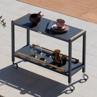 Distinguished Atmosphera Flair console with durable epoxy-coated aluminum and oiled teak surfaces offering a sleek minimalist design