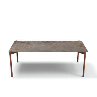 Superior Atmosphera Heritage table built with a gres tabletop in mottled grey, brown and rust with warm teak and aluminum legs