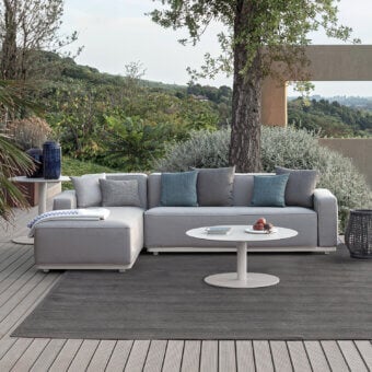 Sophisticated Atmosphera Laguna sectional with smooth woven textile upholstery and muted teal accents in a contemporary neutral gray finish
