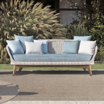 Distinctive Atmosphera Ludo sofa with organic shape and sculpted form, crafted in teak wood with muted light blue-grey striped textile upholstery