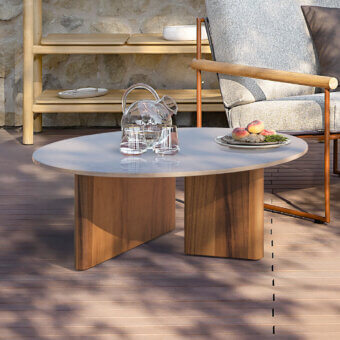 Distinctive Atmosphera Materia coffee table crafted with Asian teak and glossy glazed lava stone offering a minimalist form with intersecting base