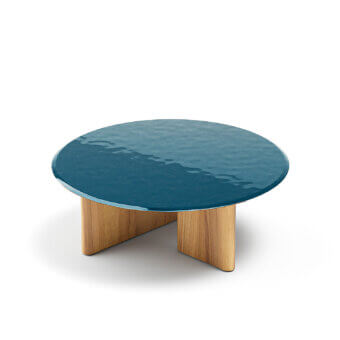Elegant Atmosphera Materia coffee table with luminous teal glazed lava stone and sculpted Asian Teak base