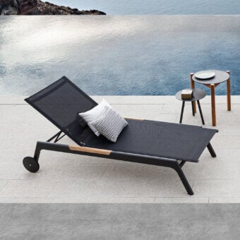 Superior Atmosphera Nevada chaise lounge in graphite aluminum with warm teak accents and dark textile mesh