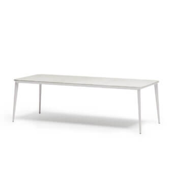 Elegant Atmosphera Origami table with folded silhouette and durable gres porcelain stoneware tabletop in matte white aluminum