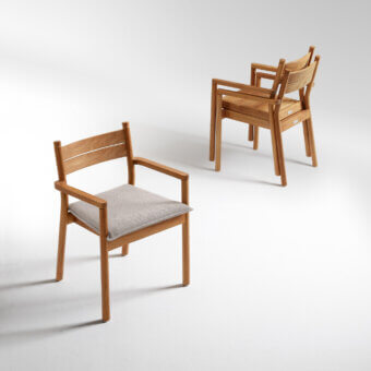 Exceptional Atmosphera Panama armchair with sculpted timber frame and comfortable neutral gray textured seat cushion