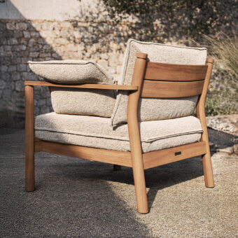 Superior Atmosphera Panama lounge chair crafted with cylindrical teak frame and neutral beige textured cushions with satin finish