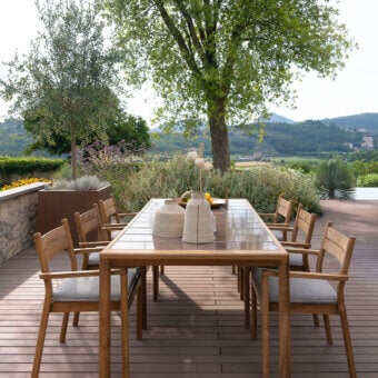 Exceptional Atmosphera Panama table crafted in warm medium-brown teak wood with a durable ceramicized lava stone tabletop and satin finish